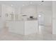Bright eat-in kitchen with white cabinets, island, and stainless steel appliances at 7335 Fountain Palm Cir # 7335, Bradenton, FL 34203