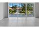 Living room with sliding glass doors leading to a balcony at 7335 Fountain Palm Cir # 7335, Bradenton, FL 34203