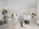 Bright and airy living room with high ceilings, and a view to the kitchen and balcony at 7335 Fountain Palm Cir # 7335, Bradenton, FL 34203