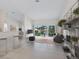 Spacious living area with large sliding doors leading to a screened balcony overlooking the community at 7335 Fountain Palm Cir # 7335, Bradenton, FL 34203