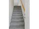 Carpeted staircase leading to the upper level of the home at 7335 Fountain Palm Cir # 7335, Bradenton, FL 34203