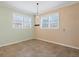 Bright dining area with two-toned walls and tile floors at 8133 Miramar Way # 201, Lakewood Ranch, FL 34202