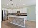 Modern kitchen with stainless steel appliances and an island at 8133 Miramar Way # 201, Lakewood Ranch, FL 34202