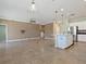 Spacious living room with tile floors and ceiling fan at 8133 Miramar Way # 201, Lakewood Ranch, FL 34202