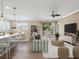 Open living area featuring a striped sofa and built-in shelving at 8133 Miramar Way # 201, Lakewood Ranch, FL 34202