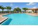 Resort-style pool with lounge chairs and a covered patio at 8133 Miramar Way # 201, Lakewood Ranch, FL 34202