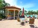 Relaxing poolside cabana with seating and a bar at 8133 Miramar Way # 201, Lakewood Ranch, FL 34202