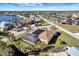 Aerial view of a single Gathering home with a large backyard and canal views at 118 Creek Se Dr, Port Charlotte, FL 33952