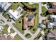 Aerial view of single Gathering home with pool and lush landscaping at 118 Creek Se Dr, Port Charlotte, FL 33952