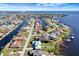 Aerial view of waterfront home with pool and canal access at 118 Creek Se Dr, Port Charlotte, FL 33952