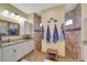 Bathroom with granite countertop, walk-in shower, and linen closet at 118 Creek Se Dr, Port Charlotte, FL 33952