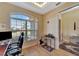 Home office with a window, desk and keyboard at 118 Creek Se Dr, Port Charlotte, FL 33952