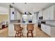 Modern kitchen featuring granite countertops, stainless steel appliances, and a breakfast bar at 118 Creek Se Dr, Port Charlotte, FL 33952