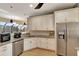 Modern kitchen with white cabinets, granite counters, and stainless steel appliances at 118 Creek Se Dr, Port Charlotte, FL 33952