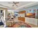 Spacious living room featuring a large TV and comfortable seating at 118 Creek Se Dr, Port Charlotte, FL 33952