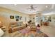 Spacious living area with comfortable seating and access to the pool and dining area at 118 Creek Se Dr, Port Charlotte, FL 33952