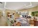 Open living room with access to the pool area and comfortable seating at 118 Creek Se Dr, Port Charlotte, FL 33952
