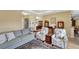 Living room with ample seating, hardwood floors, and view of entryway at 118 Creek Se Dr, Port Charlotte, FL 33952