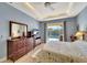 Main bedroom with a king-size bed and access to the pool at 118 Creek Se Dr, Port Charlotte, FL 33952