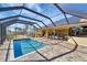 Inviting screened pool with a spacious patio area, perfect for relaxation at 118 Creek Se Dr, Port Charlotte, FL 33952