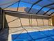 Covered patio area with pool and solar panels on the roof at 118 Creek Se Dr, Port Charlotte, FL 33952