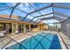 Large, screened pool and patio with plenty of space for entertaining at 118 Creek Se Dr, Port Charlotte, FL 33952