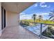 Private balcony with glass railings and scenic views at 1800 Benjamin Franklin Dr # A304, Sarasota, FL 34236
