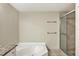 Bathroom with a large shower and a soaking tub at 1800 Benjamin Franklin Dr # A304, Sarasota, FL 34236