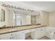 Bathroom boasts double sinks, granite countertop, and a bathtub at 1800 Benjamin Franklin Dr # A304, Sarasota, FL 34236
