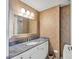 Elegant bathroom with granite countertop and decorative wall at 1800 Benjamin Franklin Dr # A304, Sarasota, FL 34236