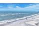 Expansive beach view with calm waves and clear sky at 1800 Benjamin Franklin Dr # A304, Sarasota, FL 34236
