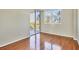 Hardwood floor bedroom with access to balcony and great view at 1800 Benjamin Franklin Dr # A304, Sarasota, FL 34236
