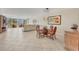 Bright dining area with glass table and ocean view at 1800 Benjamin Franklin Dr # A304, Sarasota, FL 34236