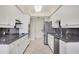Bright kitchen with granite countertops and stainless steel appliances at 1800 Benjamin Franklin Dr # A304, Sarasota, FL 34236