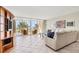 Spacious living room with ocean view and comfy sofas at 1800 Benjamin Franklin Dr # A304, Sarasota, FL 34236