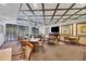 Comfortable community room with tables and chairs at 1800 Benjamin Franklin Dr # A304, Sarasota, FL 34236