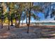 Picnic tables under shade trees by the water at 1800 Benjamin Franklin Dr # A304, Sarasota, FL 34236