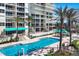 Large rectangular pool with adjacent lounge area at 1800 Benjamin Franklin Dr # A304, Sarasota, FL 34236