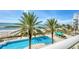 Relaxing pool area with ocean views and lush landscaping at 1800 Benjamin Franklin Dr # A304, Sarasota, FL 34236