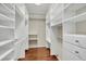 Large walk-in closet with ample shelving and hanging space at 1800 Benjamin Franklin Dr # A304, Sarasota, FL 34236
