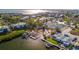 Aerial view of community, tennis courts, and waterfront at 19 Seaside Ct, Holmes Beach, FL 34217