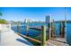 Wooden dock with lift and water access at 19 Seaside Ct, Holmes Beach, FL 34217