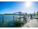 Private dock and boat lift for easy water access at 19 Seaside Ct, Holmes Beach, FL 34217