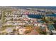 Aerial view showcasing the property's location near water and tennis courts at 19 Seaside Ct, Holmes Beach, FL 34217
