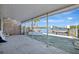 Expansive covered patio with waterfront views, perfect for outdoor entertaining with dock access at 19 Seaside Ct, Holmes Beach, FL 34217