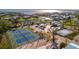 Aerial view of tennis courts and community at 19 Seaside Ct, Holmes Beach, FL 34217
