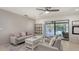 Relaxing home office with view of the pool and sliding glass doors at 2008 Country Meadows Ln, Sarasota, FL 34235