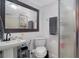 Clean bathroom with a toilet, sink, and shower at 2111 Outer Dr, Sarasota, FL 34231