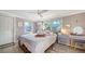 Cozy bedroom with a queen-size bed and plenty of natural light at 2111 Outer Dr, Sarasota, FL 34231