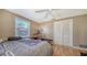 Light and airy bedroom with a queen bed and built-in closet at 2111 Outer Dr, Sarasota, FL 34231